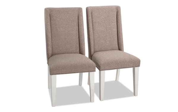 Set of 2 Montana Dining rustic solid back dining chairs in beige polyester fabric with memory foam seats, rubberwood legs, and oak veneer accents.