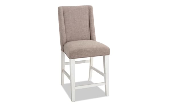 Montana Dining rustic counter height stool with beige polyester fabric upholstery, memory foam seat, and white rubberwood legs