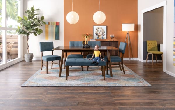 Mid-century modern Bettie 5 Piece Walnut & Gray Upholstered Extendable Dining Set with button-tufted gray polyester seats, walnut veneer table, flared legs, and removable 12" leaf for extra space.