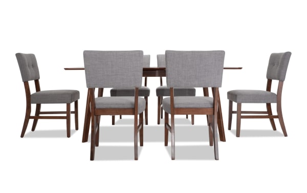 Bettie 7 Piece Walnut & Gray Upholstered Extendable Dining Set with mid-century modern style, gray polyester fabric, button tufting, flared legs, and walnut veneer wood.