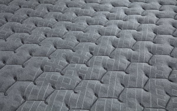 Quilted gray knit cover of Treasure 11.5'' Queen Extra Firm Mattress with geometric stitching, breathable fabric, and firm edge support.