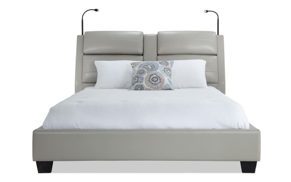 Alpha King Gray Upholstered Platform Bed in contemporary style with gray faux leather, built-in speakers, lighting, and wireless charging features.