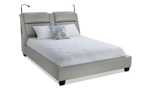 Alpha King Gray Upholstered Platform Bed in contemporary gray faux leather with built-in speakers, lighting, wireless charging, and Bluetooth.