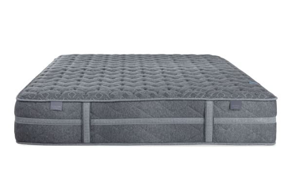 Treasure 11.5'' Queen Dual Mattress in gray with quilted knit cover, gel-infused foam, memory foam lumbar layer, and wrapped coil system for firm support and durability.
