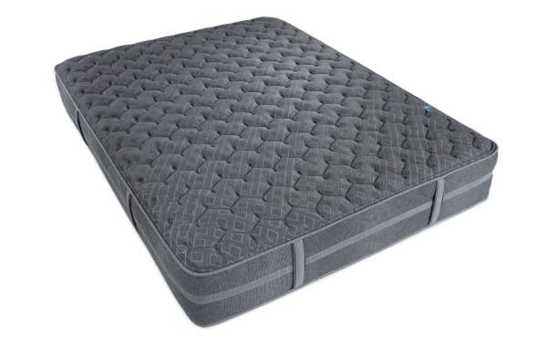 Treasure Boxed 11.5'' Queen Cushion Firm Mattress in dark gray with quilted knit cover, gel-infused foam, memory foam, and wrapped coil system for firm support and durability.