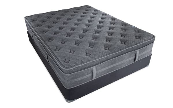Treasure 12.5'' Twin Pillow Top Plush Standard Mattress Set in dark gray with quilted knit cover, plush pillow top, and firm perimeter coils for support.