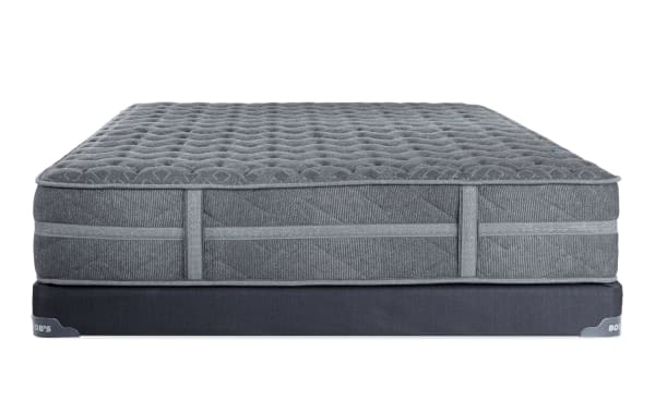 Treasure 11.5'' Twin XL Extra Firm Low Profile Mattress Set by Bob's, featuring gray quilted knit cover, gel-infused foam layers, memory foam lumbar support, and individually wrapped coils for firm, breathable, and durable sleep.