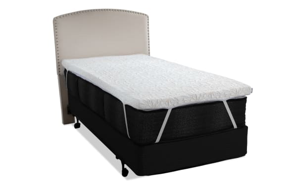 Copper Sport Twin XL Mattress Topper with white quilted cover, copper thread accents, gel memory foam, elastic straps, shown on black mattress with beige upholstered headboard.