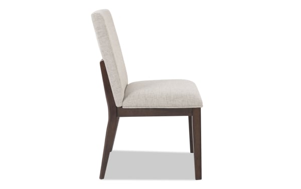 Contemporary Mango Dining chair with beige polyester fabric upholstery, solid mango wood frame, and cushioned back for ergonomic support.
