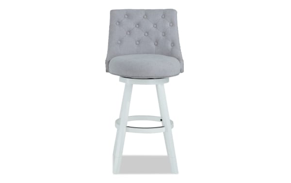 Juliette Gray transitional swivel stool with tufted gray polyester fabric seat, adjustable height, MDF frame, and memory foam cushion.