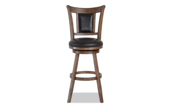 Owen Brown Faux Leather Upholstered Adjustable Height Swivel Stool with nailhead trim, memory foam seat, and transitional brown MDF frame.