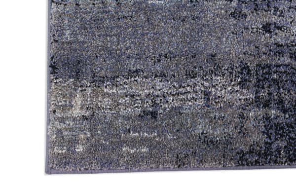 Bayou 5' x 7' Gray Abstract Rug with transitional style, soft polyester and polypropylene fabric, featuring a muted gray abstract pattern and durable, easy-to-clean texture.
