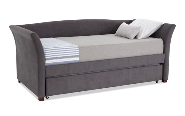 Chadwick Twin Gray Upholstered Daybed with Twin Trundle in transitional style, gray polyester fabric, curved armrests, and hidden rolling trundle for extra sleeping space.