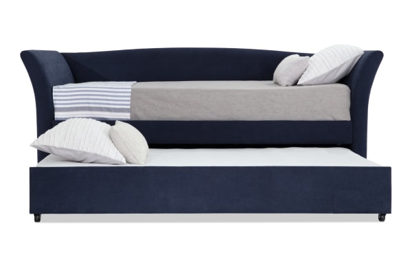 Chadwick Twin Navy Upholstered Daybed with Twin Trundle in blue polyester fabric, transitional style with curved backrest and pull-out lower bed for space-saving comfort.