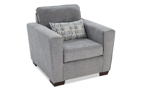 Dylan Slate Chair in gray polyester fabric with memory foam cushioning, transitional style, wide arms, and a patterned accent pillow.