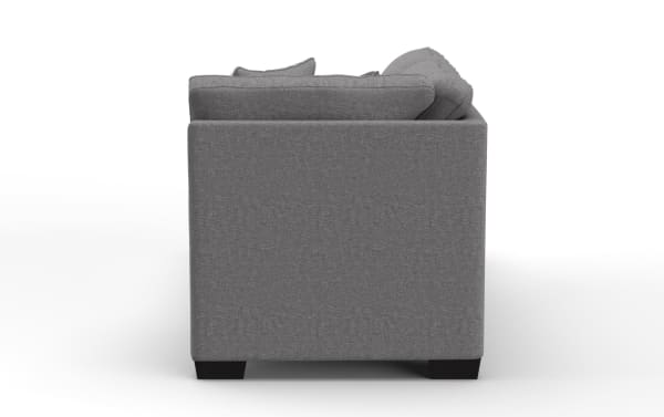 Gray fabric upholstered sofa side view showing clean lines, square armrest, and dark wooden block legs, suitable for modern living rooms.