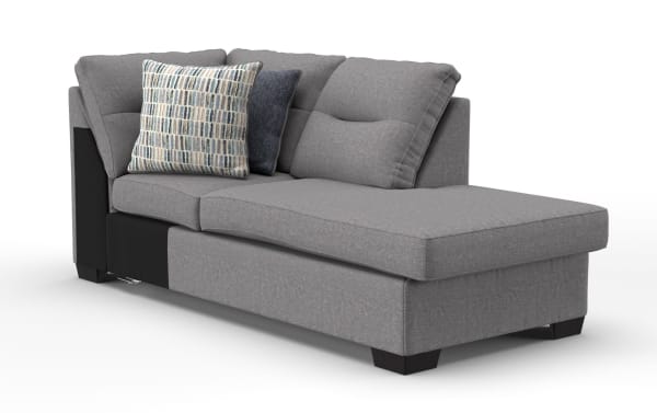 Modern gray fabric sectional chaise lounge sofa with soft cushions, patterned and solid throw pillows, and dark wooden legs, ideal for living room seating.
