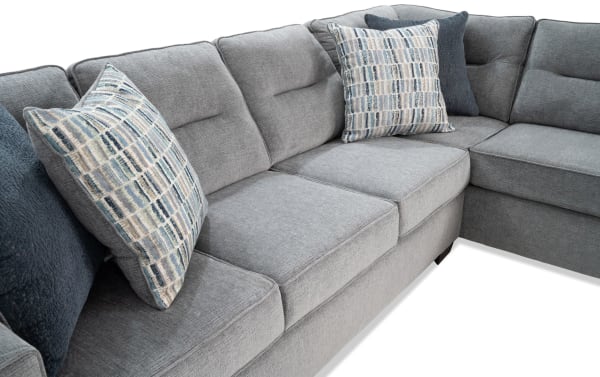 Dylan Slate 112'' 2 Piece Right Arm Facing Chaise Sectional in gray polyester fabric with memory foam cushions, transitional style, and four patterned accent pillows.
