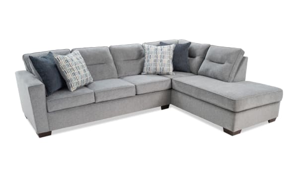 Dylan Slate 112'' 2 Piece Right Arm Facing Chaise Sectional in gray polyester fabric, transitional style with memory foam cushions and four accent pillows.