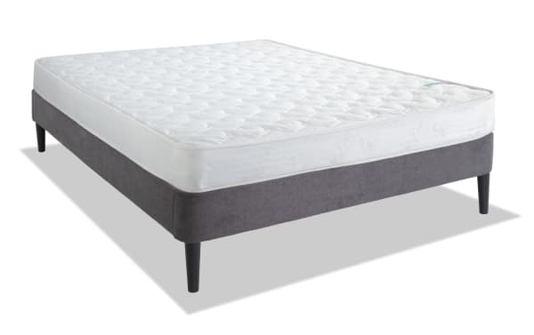 Perfection 6.5'' Full Firm Universal Mattress Set with white quilted innerspring mattress and gray upholstered platform bed frame with black tapered legs.