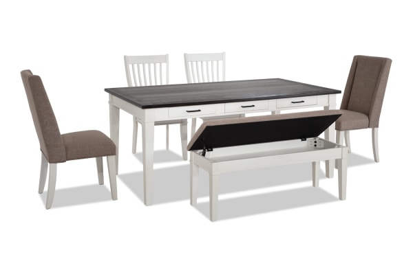 Montana 6 Piece Rustic Dining Set with white rubberwood base, distressed oak veneer top, beige polyester fabric chairs, and a storage bench with memory foam seat.