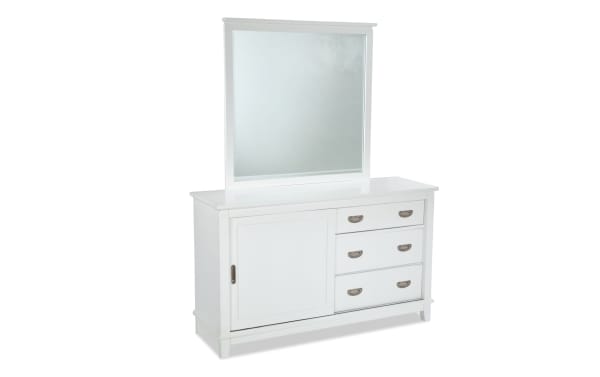 Chadwick White 3 Drawer Dresser & Mirror in transitional style, made of MDF, poplar solids, and veneers. Features a white finish, three felt-lined drawers, sliding door cabinet, and attached mirror for versatile child’s room storage.
