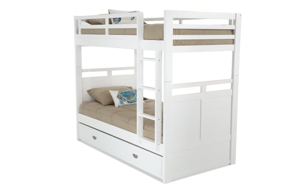 Chadwick Twin/Twin white bunk bed with twin trundle, transitional style, made of poplar solids and veneers, featuring guardrails and ladder for kids' space-saving sleepovers.