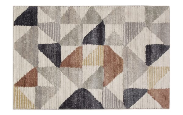 Contemporary Margot 5' x 7' multi geometric rug with 1-inch thick soft polypropylene pile in warm earth tones, perfect for casual, cozy interiors.