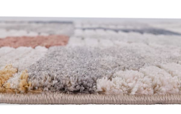 Close-up of the Margot 5' x 7' Multi Geometric Rug showing its 1-inch thick, soft polypropylene pile in multicolored Earth tones, perfect for casual, contemporary interiors.
