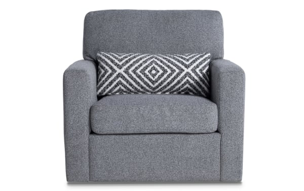 Transitional Playday Gray Swivel Chair with soft gray polyester fabric, plush memory foam cushions, and a geometric patterned accent pillow.