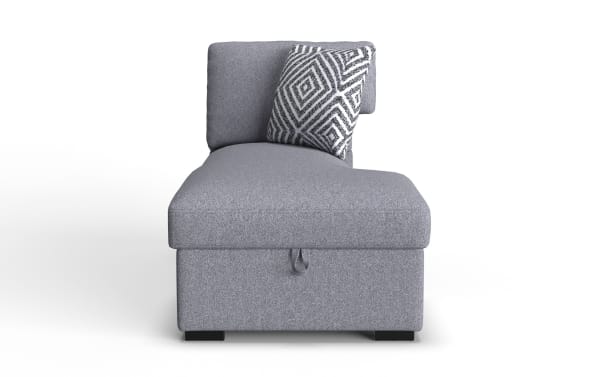 Gray upholstered chaise lounge with a geometric patterned throw pillow, featuring a cushioned backrest and storage compartment.