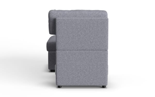 Modern gray fabric upholstered sectional sofa viewed from the side, showcasing its clean lines, cushioned backrest, and black cylindrical legs.