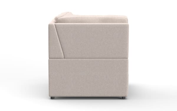 Beige fabric upholstered sofa side view showing clean lines, cushioned armrest, and modern block-style design.