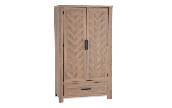 Calvin Light Brown 2 Drawer Armoire from Calvin Bedroom collection, transitional style with MDF/acacia veneers, chevron door design, natural wood grain, adjustable rod, and shelves.