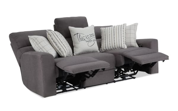 Modern Farmhouse Gray 86'' power reclining sofa with power headrest, gray polyester fabric, transitional style, includes five decorative pillows and extended footrests.