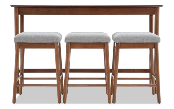 Mid-century modern wooden dining table with three matching stools featuring gray upholstered seats and tapered legs.