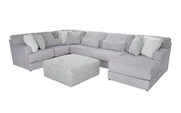 Sofia Gray 159'' 4-piece right arm facing chaise sectional with patterned ottoman, gray polyester fabric, transitional style, channel tufted back cushions, and nine faux fur pillows for luxury and comfort.