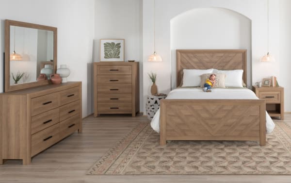 Calvin Full Light Brown Panel Bed from Calvin Bedroom Collection, transitional style with MDF engineered wood grain, chevron design headboard and footboard, natural wood grain finish, paired with matching dresser, chest, and nightstand in a modern bedroom setup.