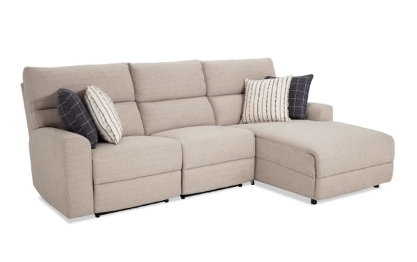 Modern Farmhouse beige 106'' power reclining 3-piece sectional with right arm chaise, armless chair, power headrest, polyester fabric upholstery, and decorative pillows.