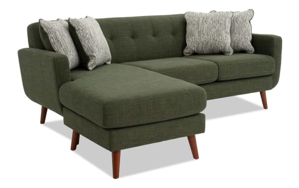 Bettie Avocado 86'' Chofa mid-century modern sectional sofa in green polyester fabric with tufted back, movable chaise, wooden legs, and four patterned pillows.