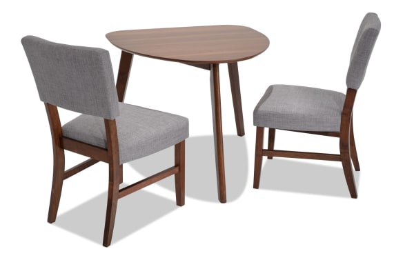 Bettie 3 Piece Walnut & Gray Upholstered Triangle Dining Set with mid-century modern rubberwood frame, gray polyester fabric, and flared legs.