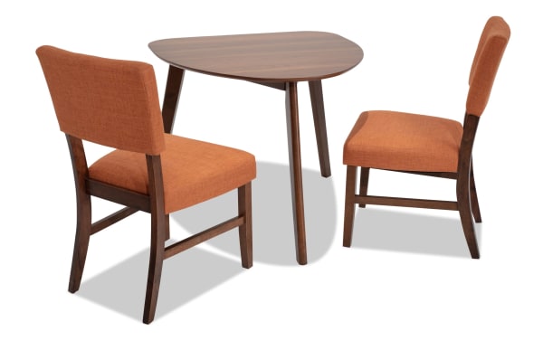 Bettie 3 Piece Walnut & Russet Upholstered Triangle Dining Set with mid-century modern rubberwood frame, walnut veneer table, and russet polyester fabric chairs with memory foam seats.