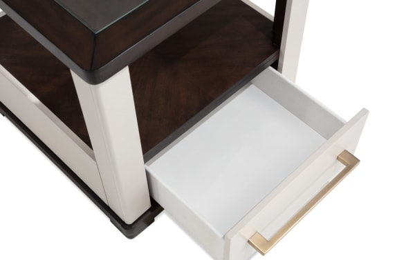 Contempo Ivory & Espresso Storage End Table with contemporary style, featuring ivory MDF drawer, espresso wood shelves, tempered glass top, and brass handle.