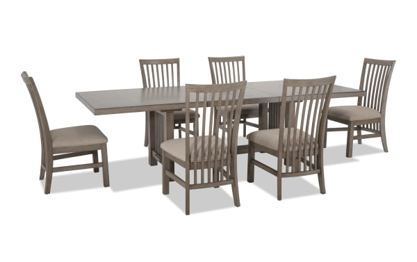 Artisan 7 Piece Gray Upholstered Extendable Dining Set with beige polyester fabric seats, oak veneer tabletop, and transitional style chairs.