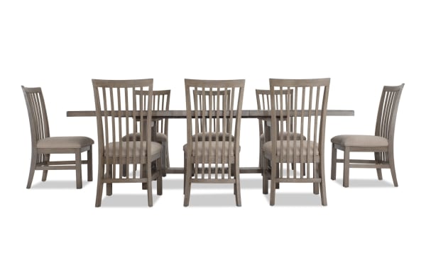 Artisan 9 Piece Gray Upholstered Extendable Dining Set with beige polyester fabric seats, oak veneer table, and transitional style chairs.
