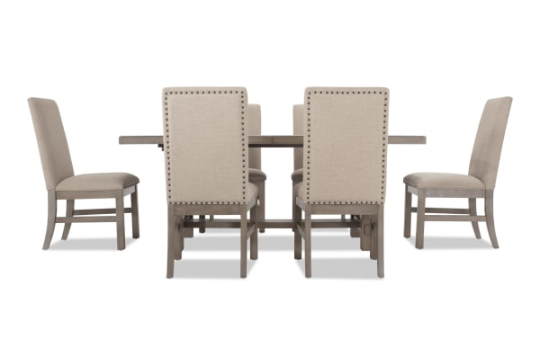 Artisan 7 Piece Gray Upholstered Extendable Dining Set with beige polyester fabric chairs, oak veneer table, and two 14" leaves for extra seating.