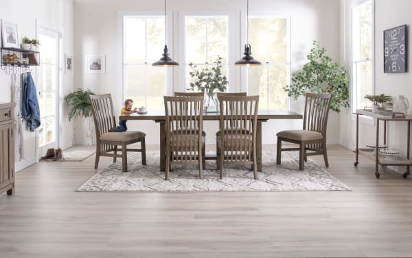 Transitional Artisan 7 Piece Gray Upholstered Extendable Dining Set with beige polyester fabric chairs, oak veneer table, and two 14" leaves for extra seating.