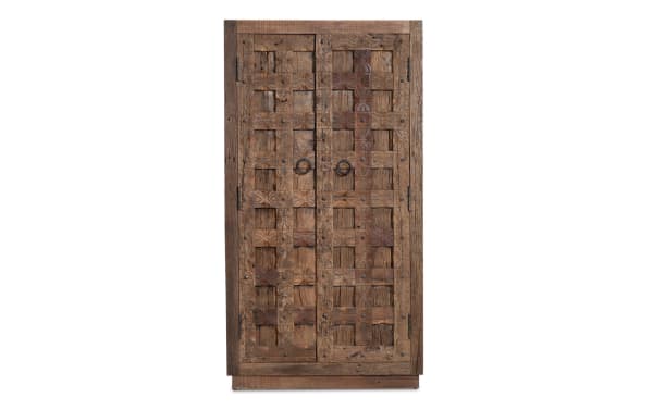 Brown 2 Door Hand Carved Reclaimed Wood Cabinet with traditional lattice-style doors, unique hand-carved floral patterns, and metal ring handles.