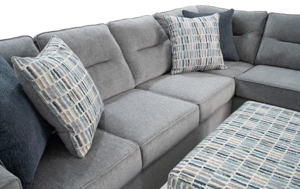 Dylan Slate 112'' 2 Piece Right Arm Facing Chaise Sectional with Ottoman in gray polyester fabric, transitional style, memory foam cushions, four patterned accent pillows, and matching ottoman.