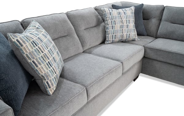 Dylan Slate 112'' 2 Piece Right Arm Facing Chaise Sectional in gray polyester fabric, transitional style with memory foam cushions and four patterned accent pillows.